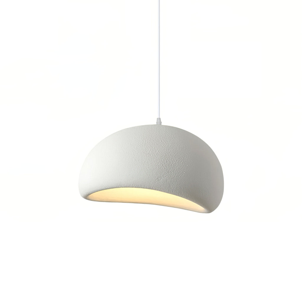 Cloud-shaped pendant light glowing softly above a styled interior