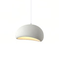 Cloud-shaped pendant light glowing softly above a styled interior