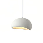 Cloud-shaped pendant light glowing softly above a styled interior