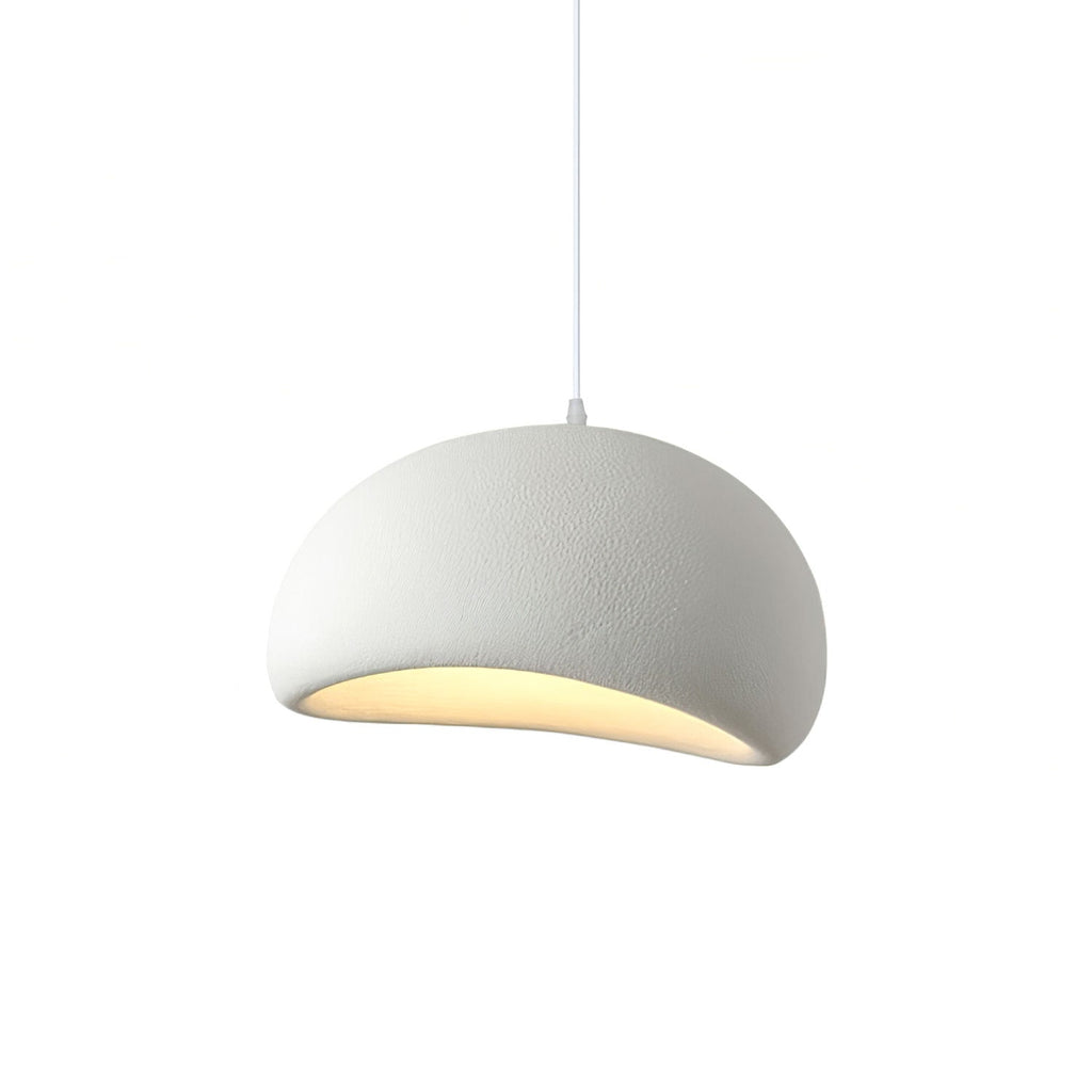 Cloud-shaped pendant light hanging above a neutral interior