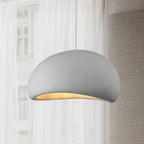 Round cloud pendant light glowing gently in a cozy room