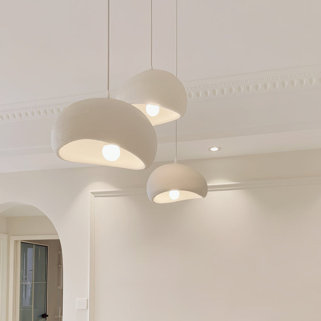 Wabi-sabi organic chandelier with textured forms in soft light