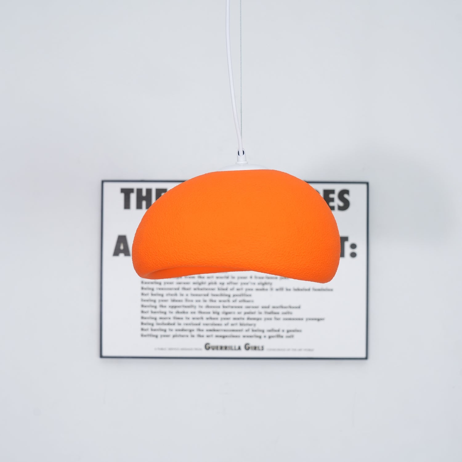 Soft cloud-shaped pendant light glowing above a styled interior