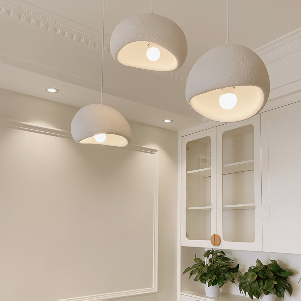 Round cloud pendant light diffusing a dreamlike light in a room