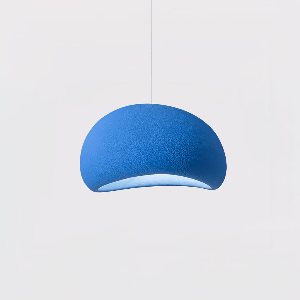 Sphere cloud pendant light casting gentle light over seating