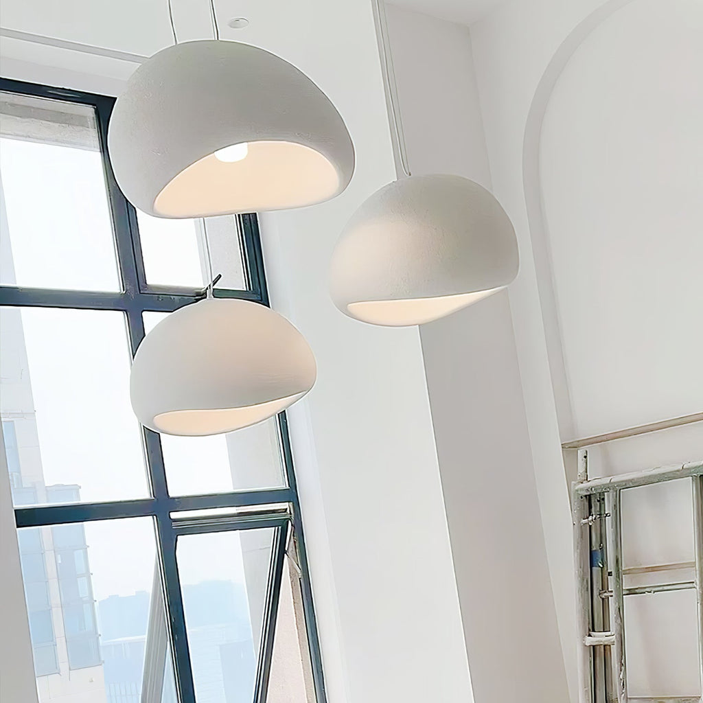 Wabi-sabi organic chandelier with cloud-like form over a space