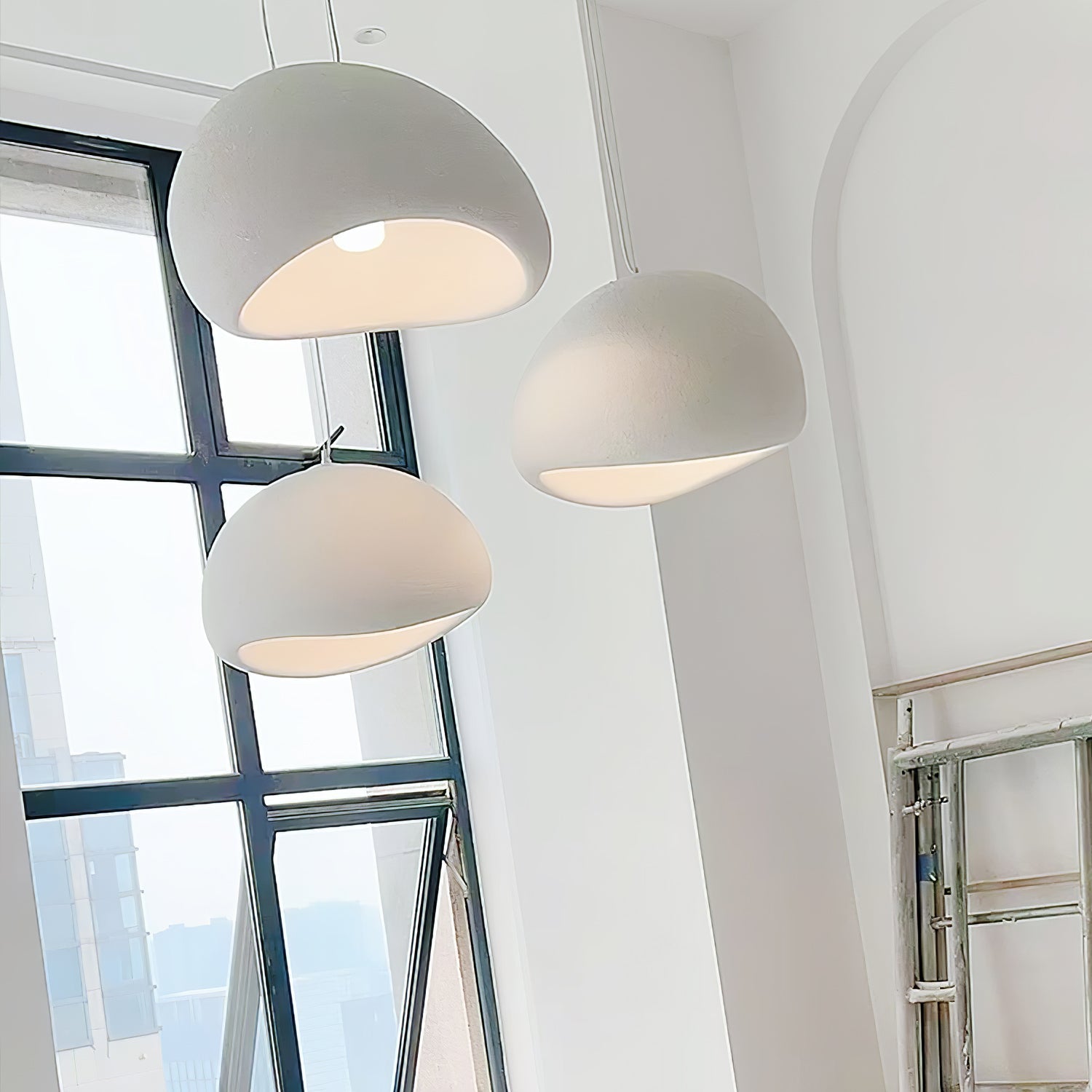 Wabi-sabi organic chandelier with cloud-like form over a space