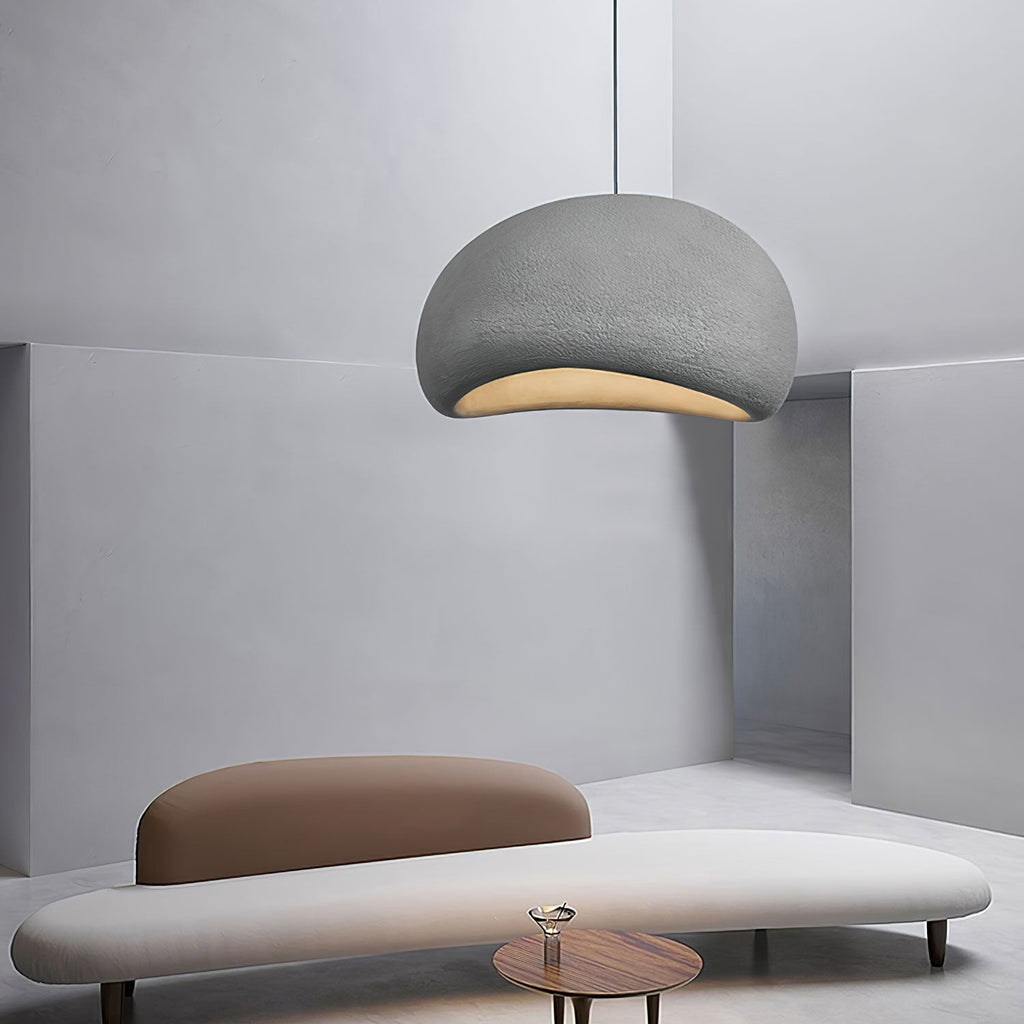 Round cloud pendant light glowing softly in a styled setting