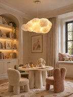 Bookshelves and a plush bunny frame this lit Clérachic cloud pendant in a child's playroom.