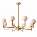 Photographed on white, the brass finish of this Clérachic chandelier fans eight arms outward from a central stem.