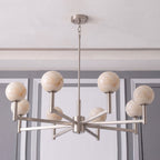 Photographed unlit on white, this Clérachic chandelier's nickel arms radiate outward from a central chain mount.