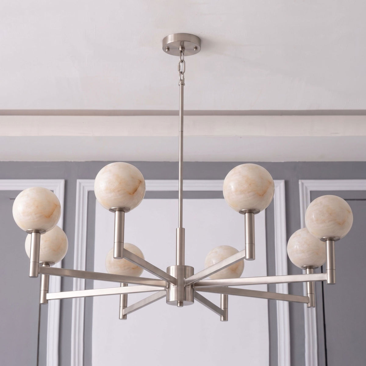 Photographed unlit on white, this Clérachic chandelier's nickel arms radiate outward from a central chain mount.