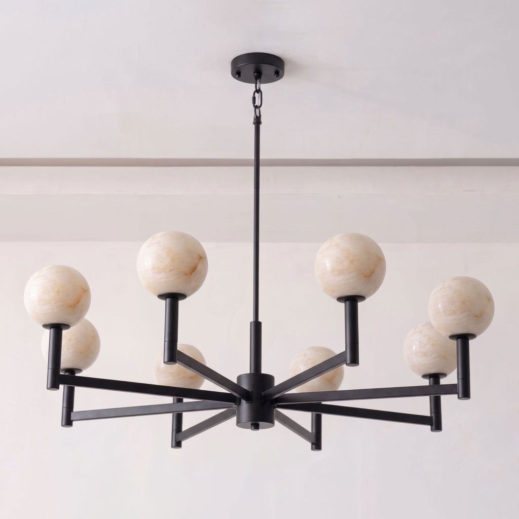 Shown on a plain white background, the matte black frame of this Clérachic chandelier crosses into eight angled arms.
