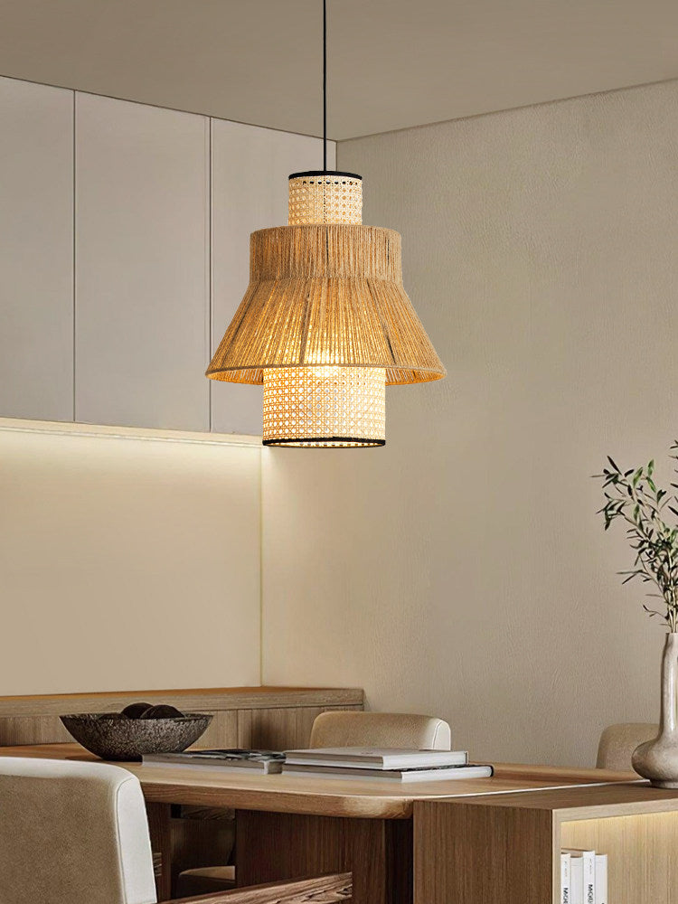 This Clérachic pendant glows warm in a kitchen nook, its light reaching a shelf of books and a ceramic bowl.