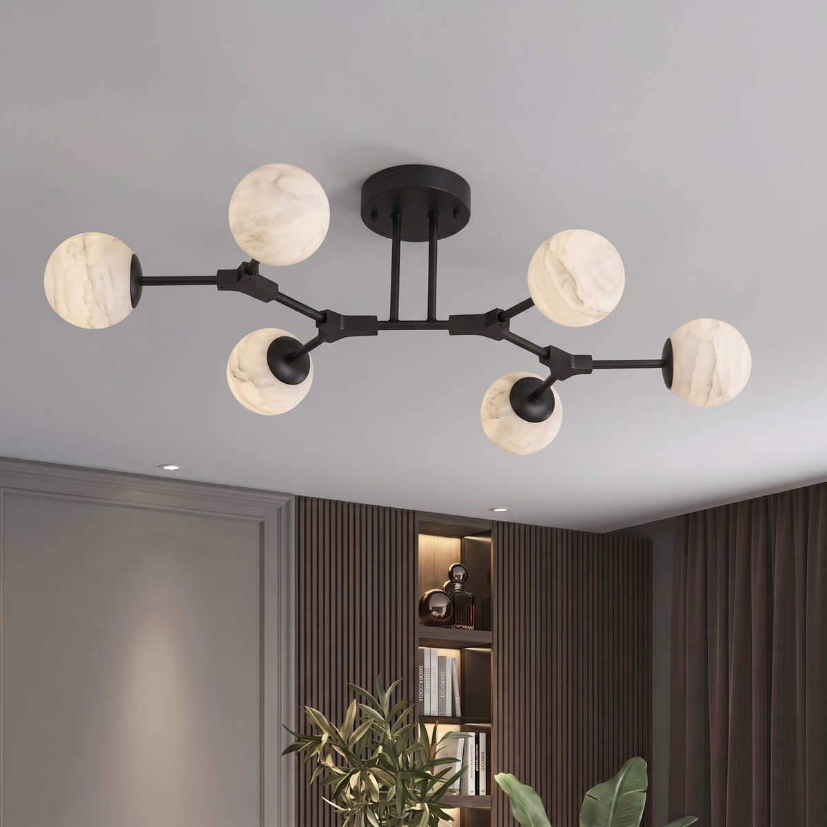 Photographed in matte black against white, this Clérachic chandelier's six arms fan out at differing lengths.