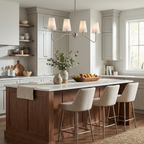 Above a grey kitchen island with fruit and greenery, this Clérachic chandelier lights the room in a brushed nickel finish.