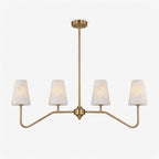 Angled on a plain white backdrop, the brushed brass chevron arms of this Clérachic chandelier spread wide beneath a central rod.