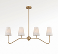 Front view on a plain white backdrop, this Clérachic chandelier's brushed brass arms fan out to four tapered alabaster cone shades.