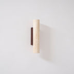 Close studio view of this Clérachic wall light, unlit, walnut wood backplate clearly visible.