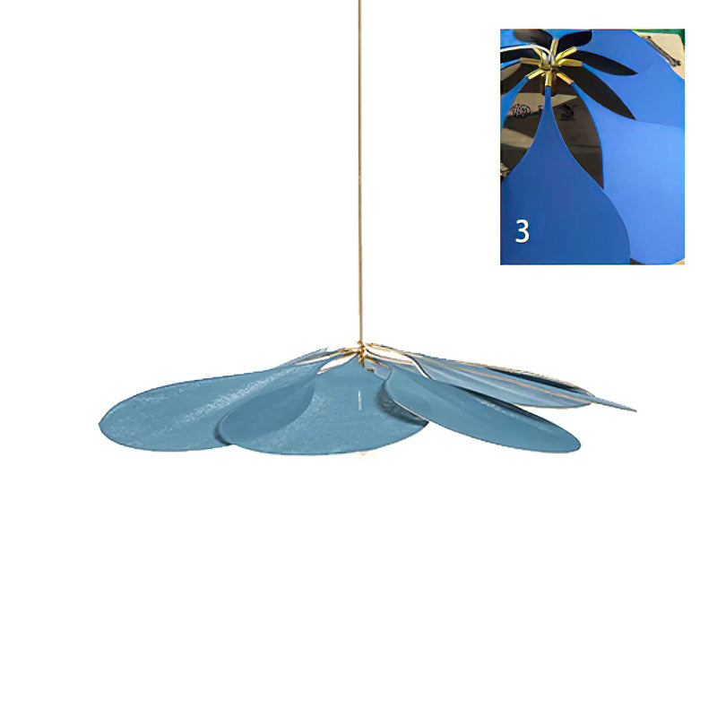 This Clérachic pendant lamp in a blue version is shown at an angle, with a close-up inset of the petals against a blue backdrop.
