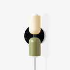 Couleur Double wall lamp mounted on a neutral interior wall