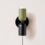 Couleur Double wall lamp shown against a styled wall
