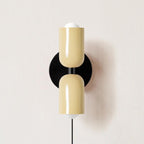 Couleur Double wall lamp shown mounted vertically on a wall