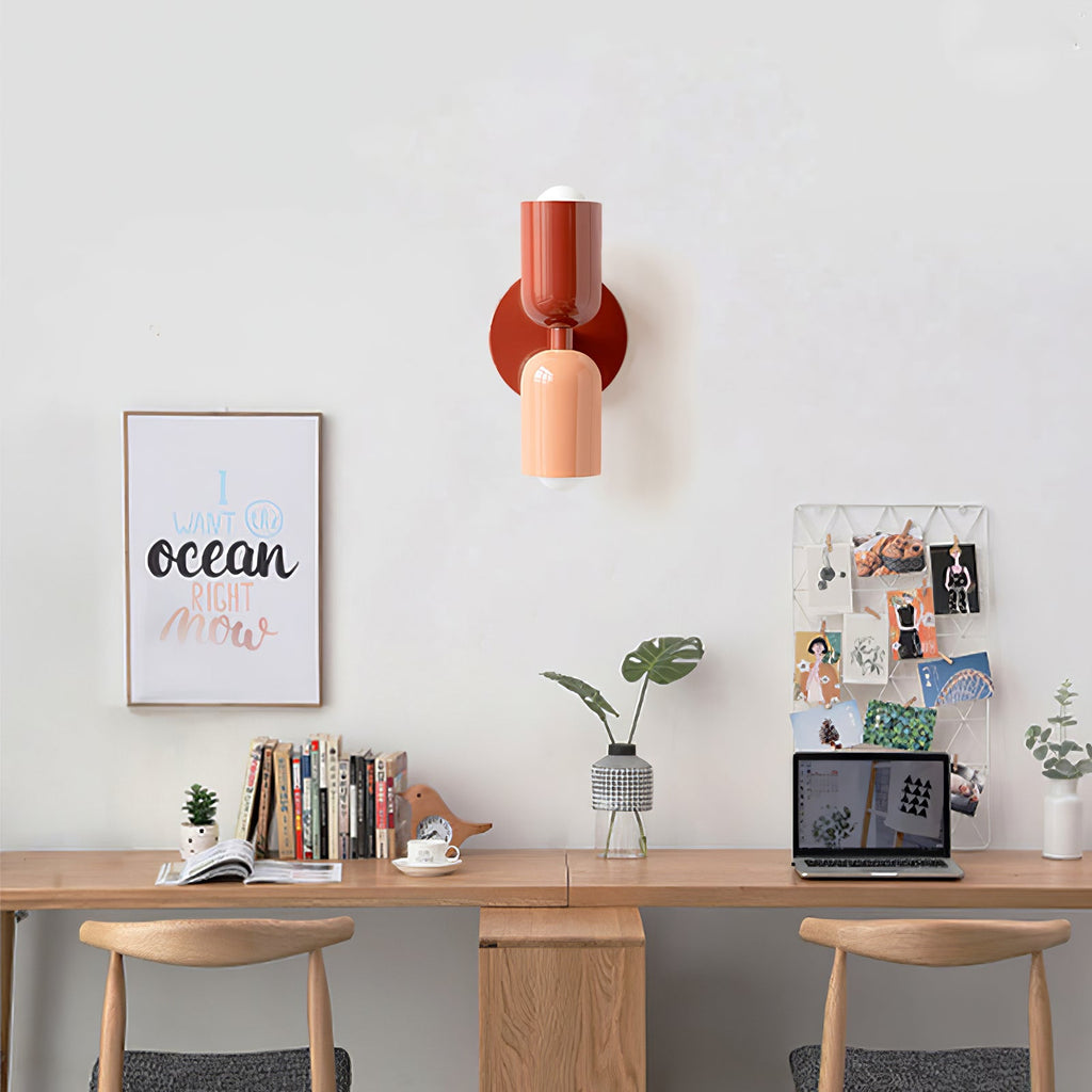Wall lamp with coloured shade in a soft-lit setting
