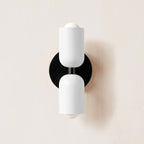 Black metal wall lamp shown against a plain background
