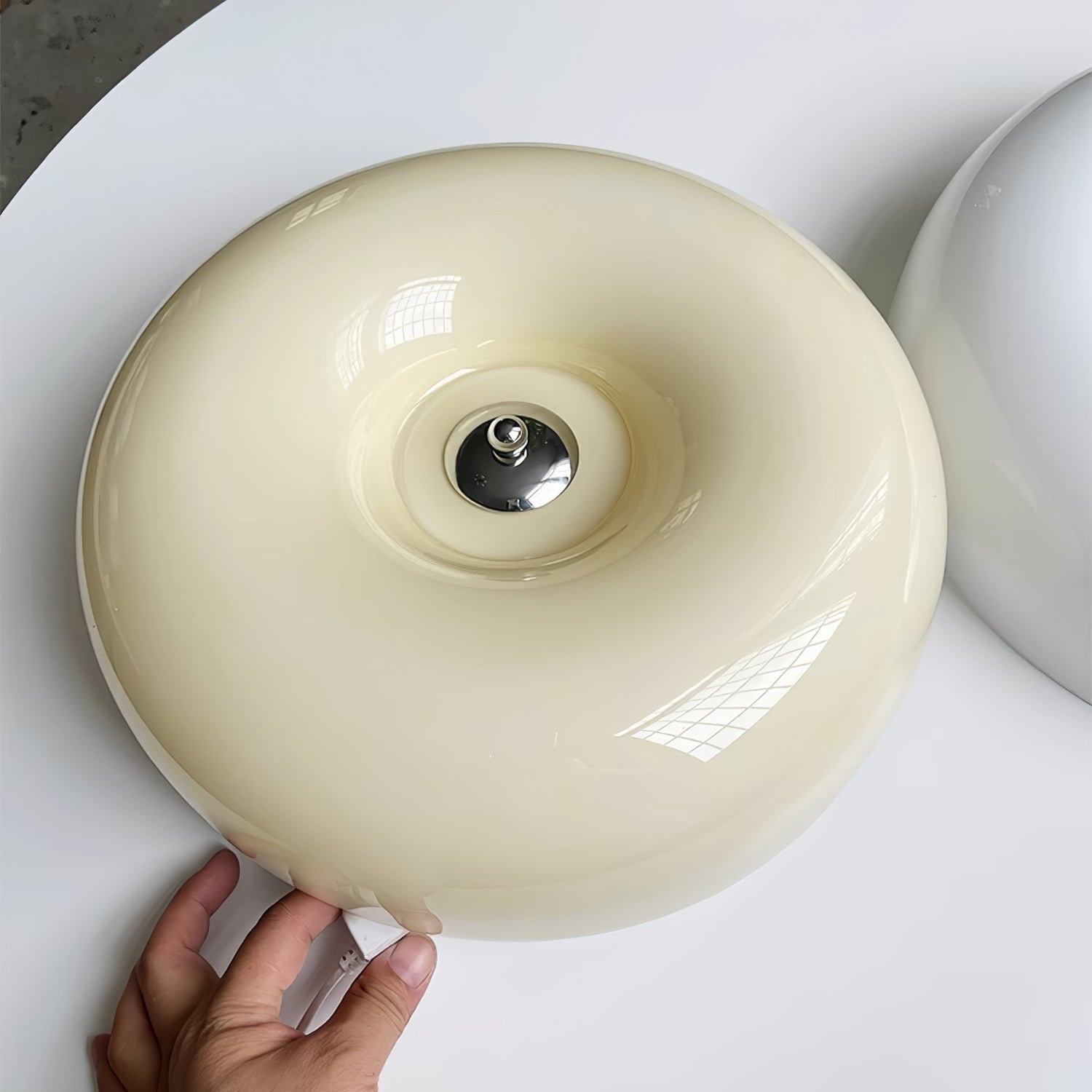 Cream Pudding ceiling light mounted flush against a ceiling