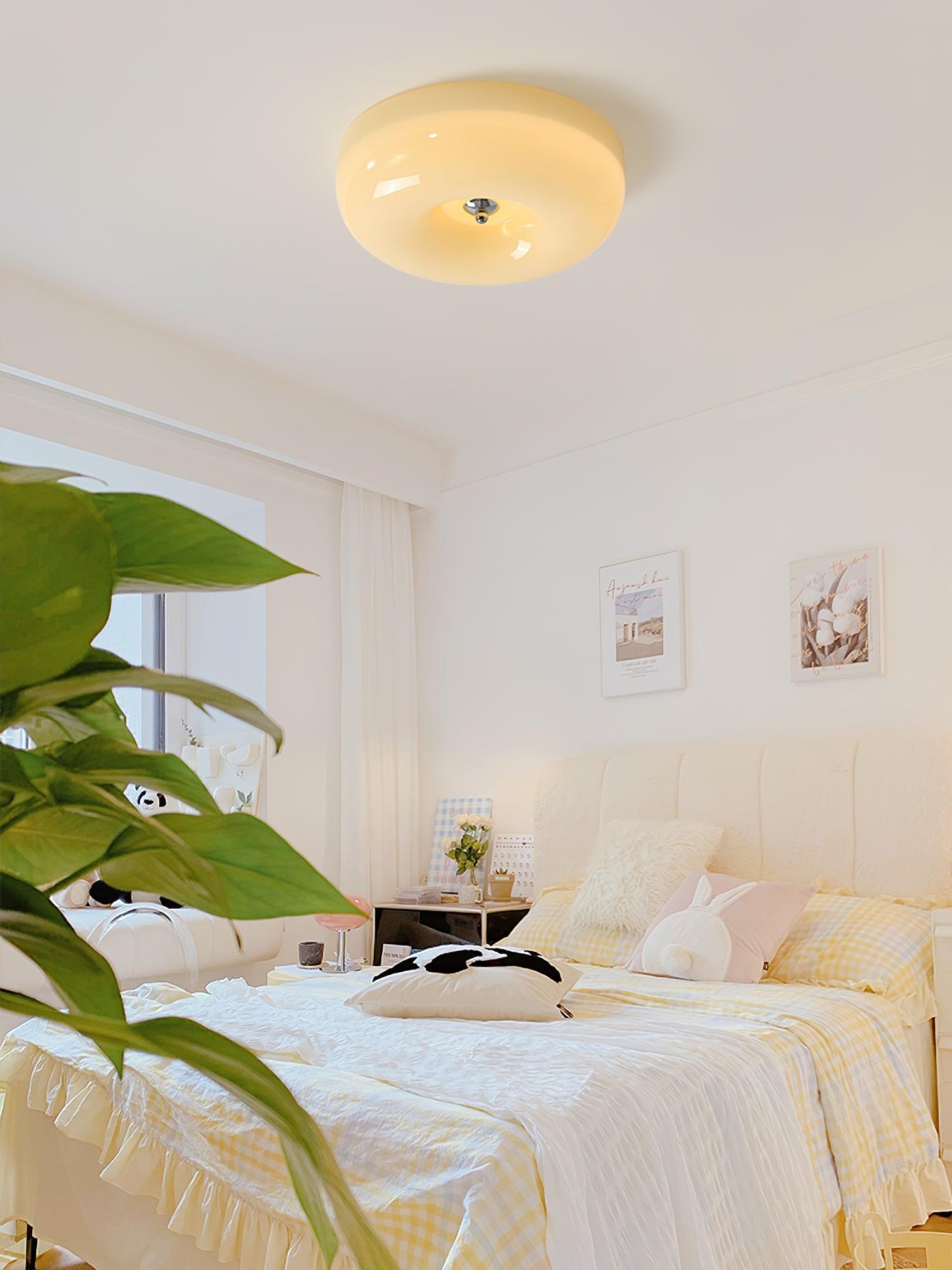 Cream Pudding ceiling light glowing warm in an interior