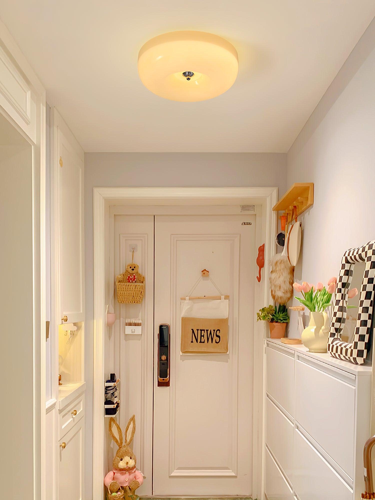 Cream Pudding ceiling light round shade lit evenly