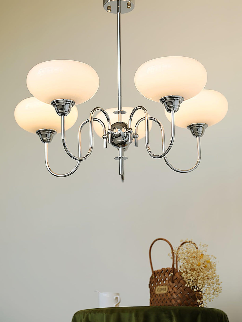Persimmon chandelier with rounded glass globes turned on