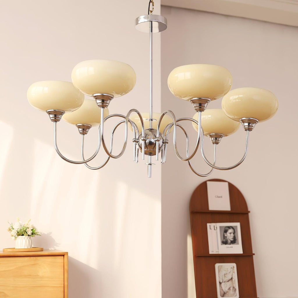Persimmon chandelier shown lit in a home interior
