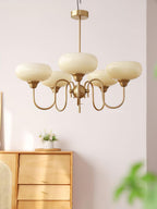 Persimmon chandelier in a warm-toned interior space