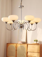 Persimmon chandelier with chrome body and milk-white globes