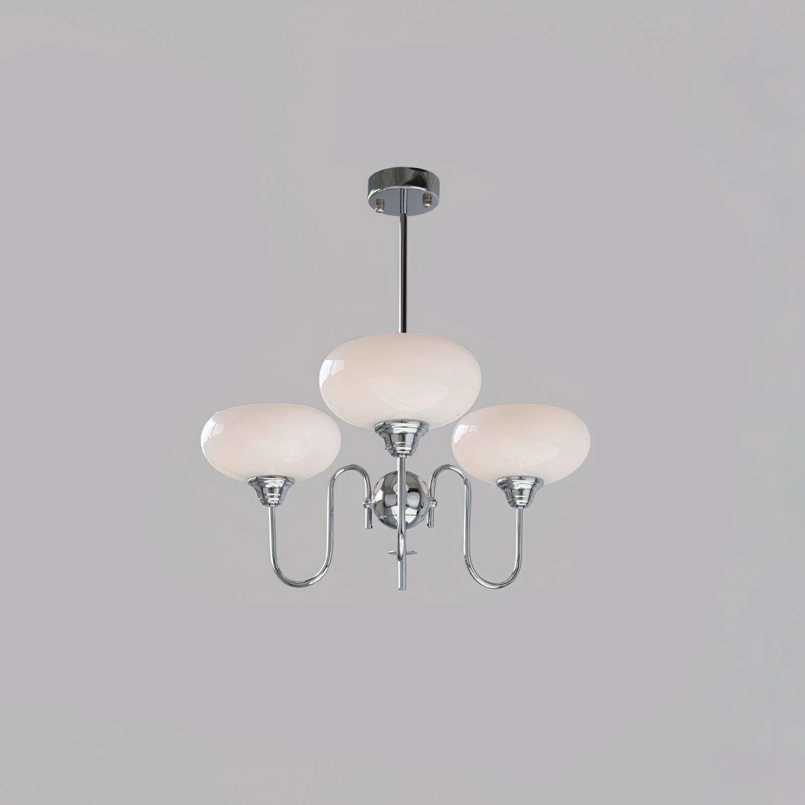 Persimmon chandelier glowing softly above a living space