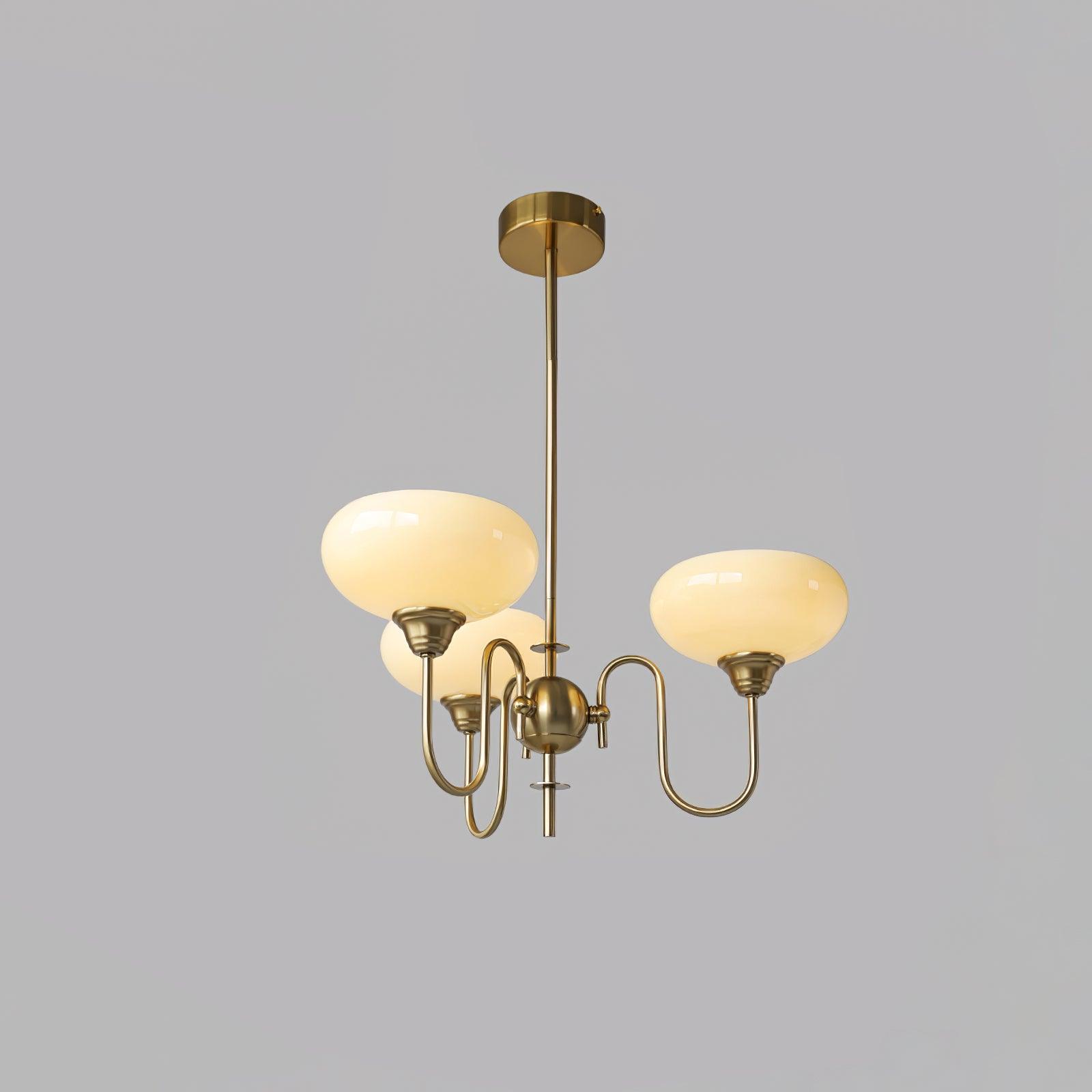 Cluster of creamy mouth-blown glass shades on the persimmon chandelier