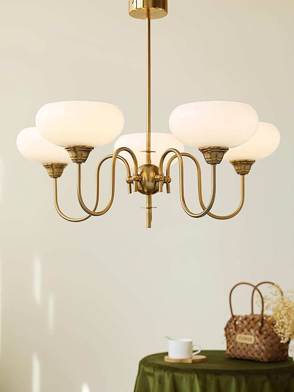 Persimmon chandelier glowing over a dining setting