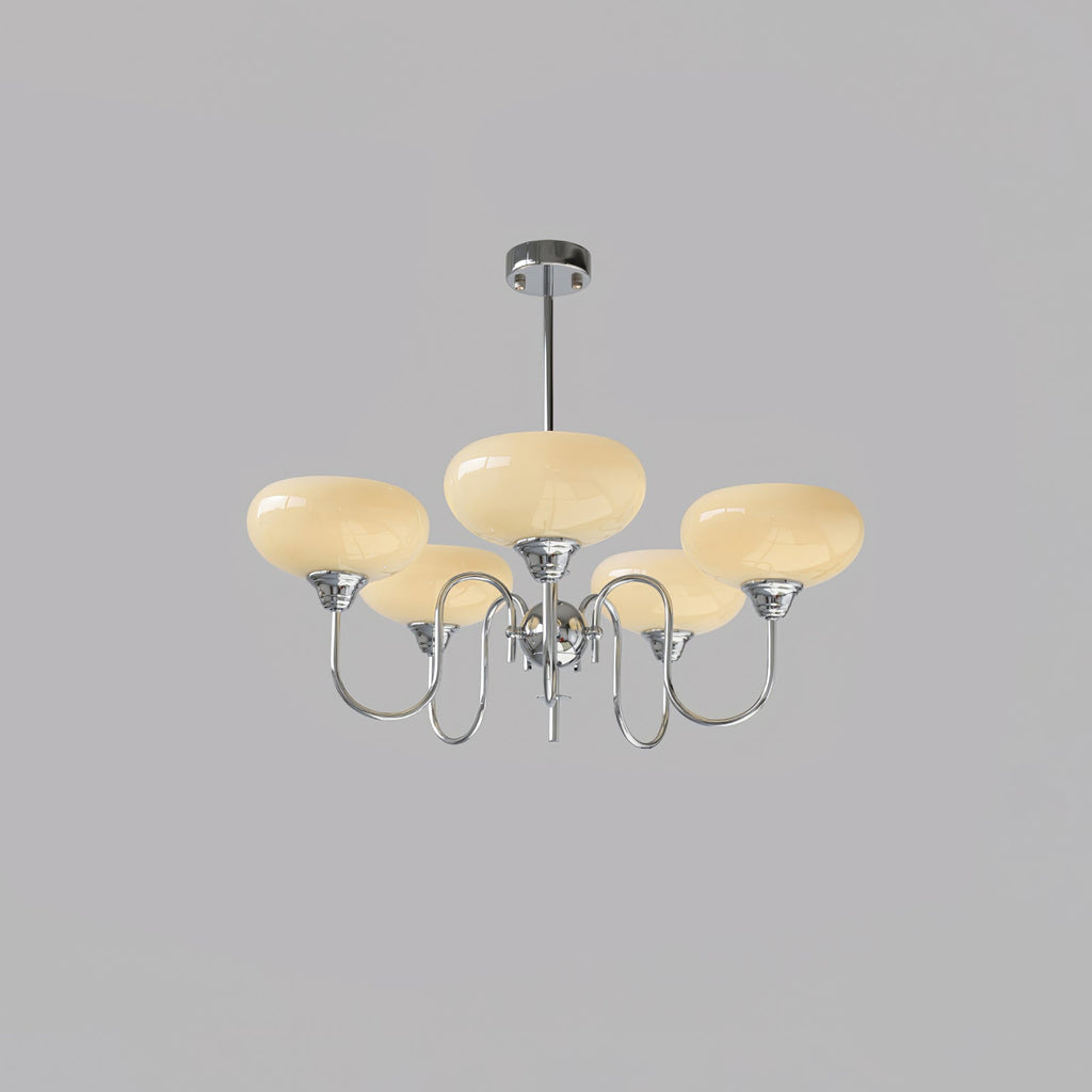 Persimmon chandelier lit against a soft neutral backdrop