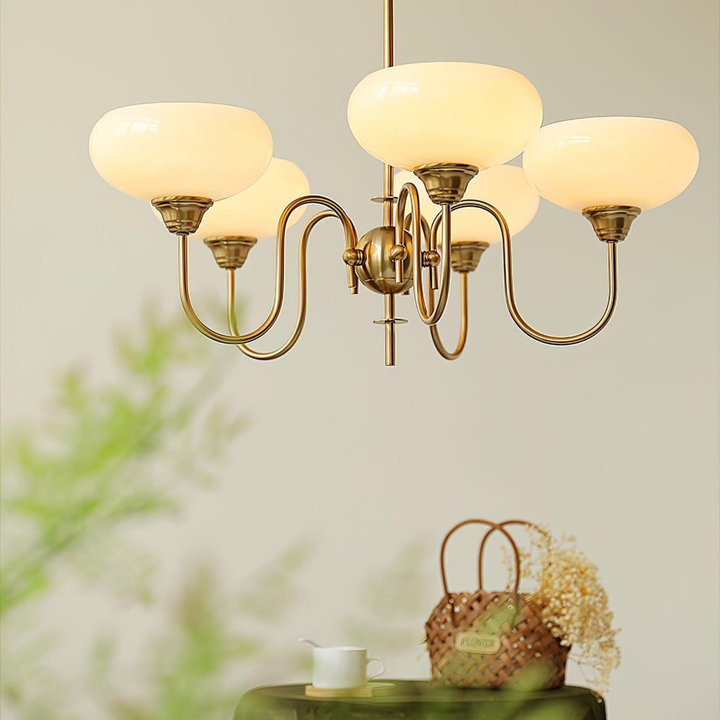 Persimmon chandelier illuminated above an interior setting