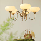 Persimmon chandelier illuminated above an interior setting
