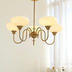 Persimmon chandelier glass cluster against a pale wall