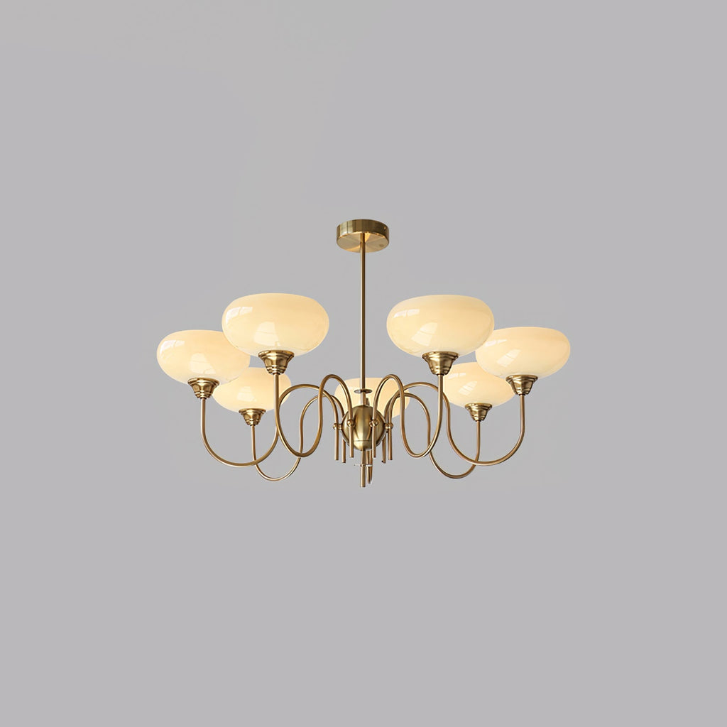 Warm-lit persimmon chandelier in a styled room