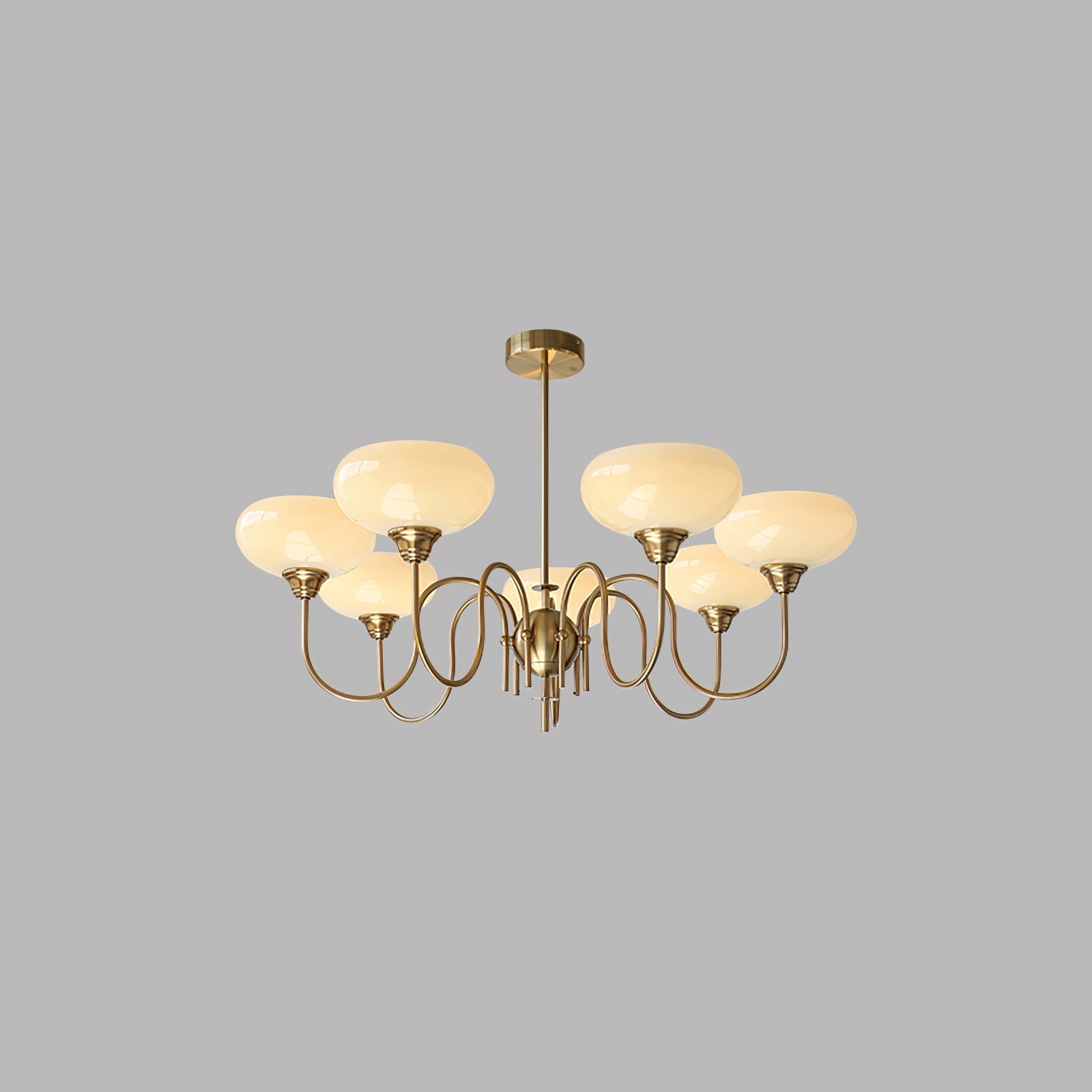 Warm-lit persimmon chandelier in a styled room