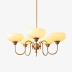 Persimmon chandelier detail with delicate creamy glassware