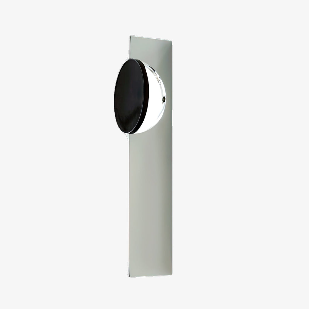 Kinetic Shadow chrome wall lamp mounted on a plain wall