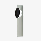 Kinetic Shadow chrome wall lamp mounted on a plain wall