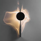 Chrome wall lamp casting shifting light and shadow on a wall