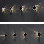 Mirrored chrome wall lamp throwing dramatic shadow lines